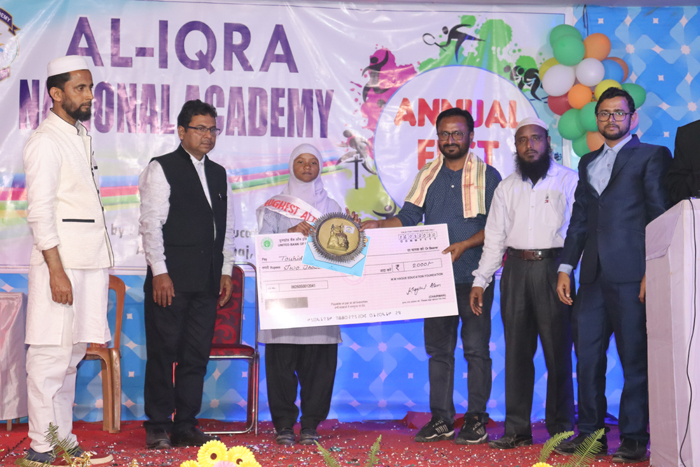 Touhida Aktar Khan student of AINA receiving Highest Attendance Award
